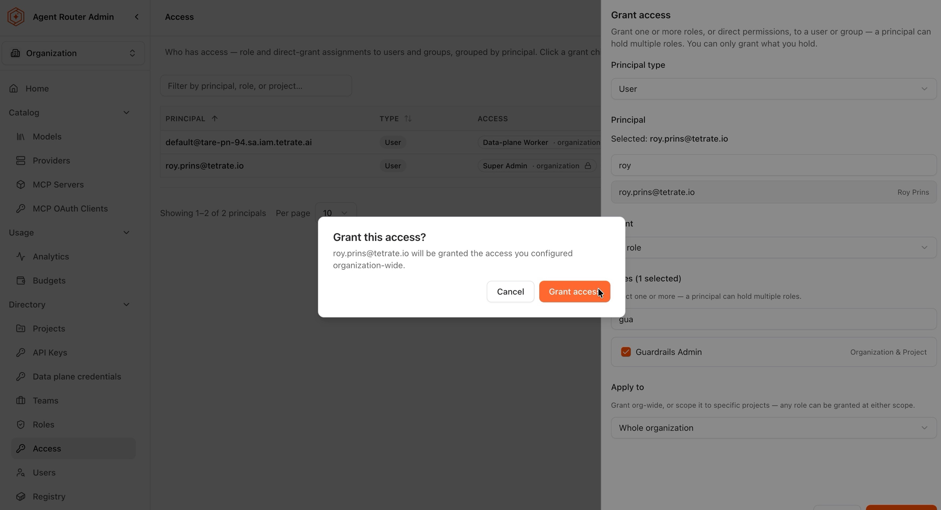 Confirmation dialog naming the user and the organization-wide scope