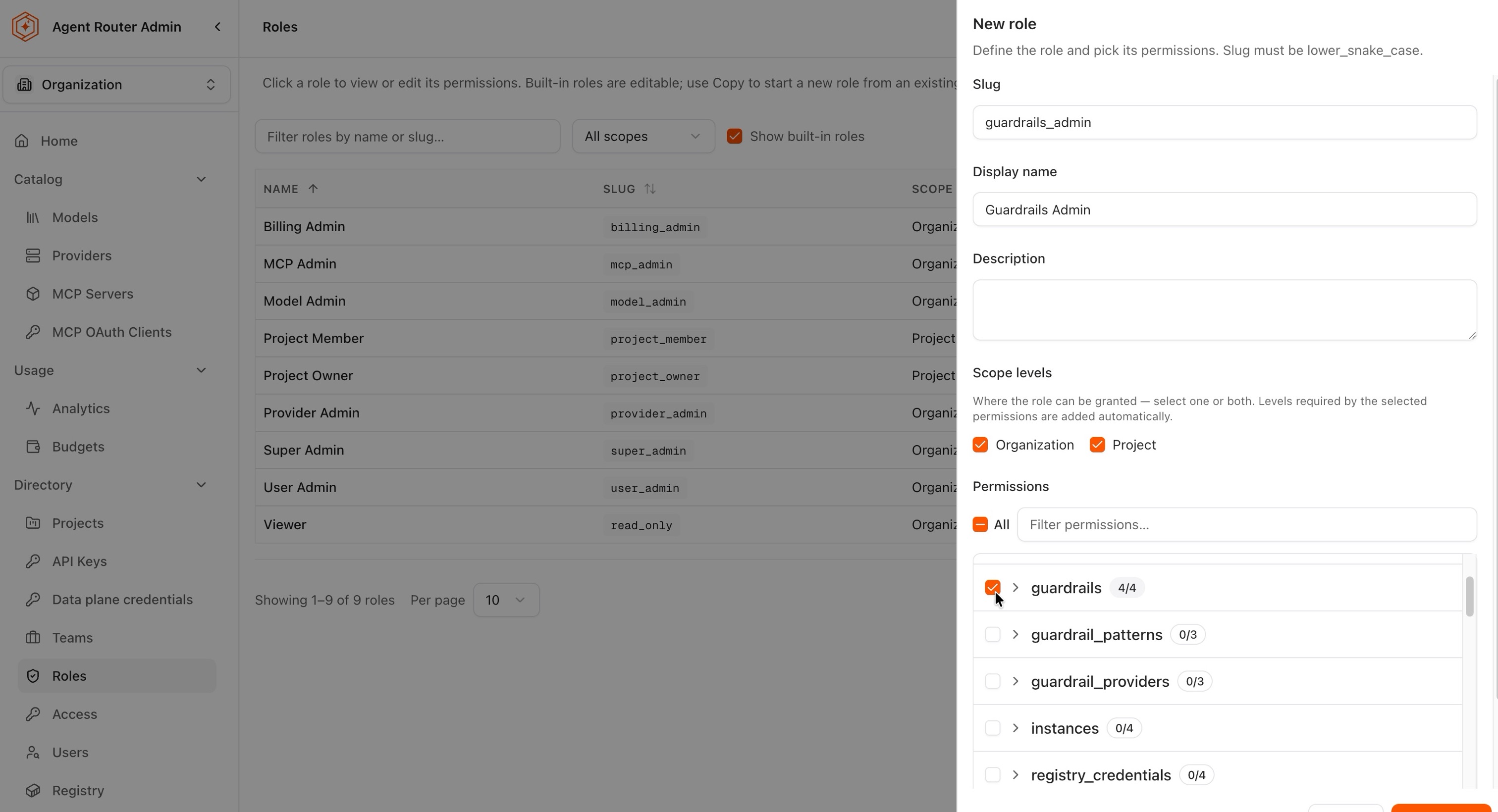 New role panel with slug, display name, scope levels, and the guardrails permission group selected